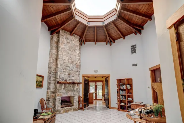 a view of a livingroom with furniture and staircase