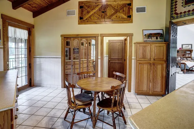 a dining room with furniture and window