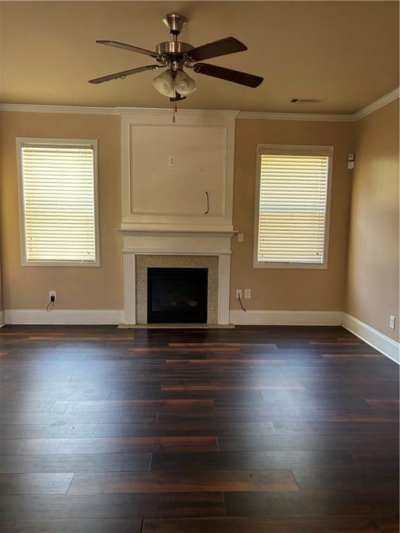 7562 Watson Circle Locust Grove, GA 30248 - Photo 17 of 66 an empty room with wooden floor fireplace and windows