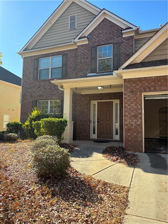 7562 Watson Circle Locust Grove, GA 30248 - Photo 2 of 66 a front view of a house with a yard
