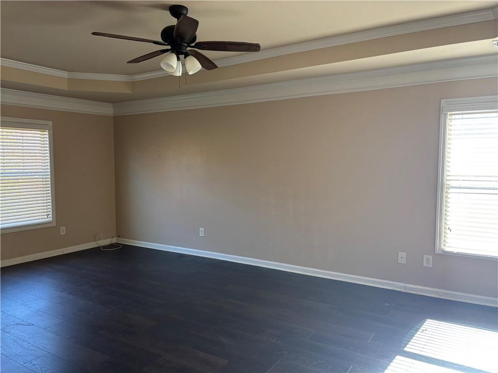 7562 Watson Circle Locust Grove, GA 30248 - Photo 25 of 66 an empty room with wooden floor and windows