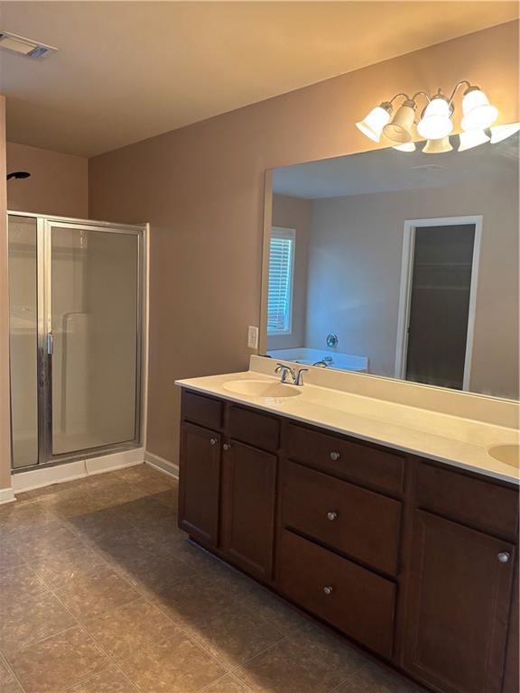 7562 Watson Circle Locust Grove, GA 30248 - Photo 27 of 66 a bathroom with a sink and a mirror