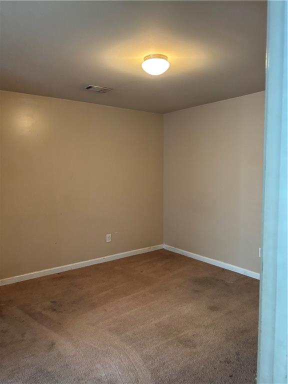 7562 Watson Circle Locust Grove, GA 30248 - Photo 35 of 66 an empty room with a space and a window