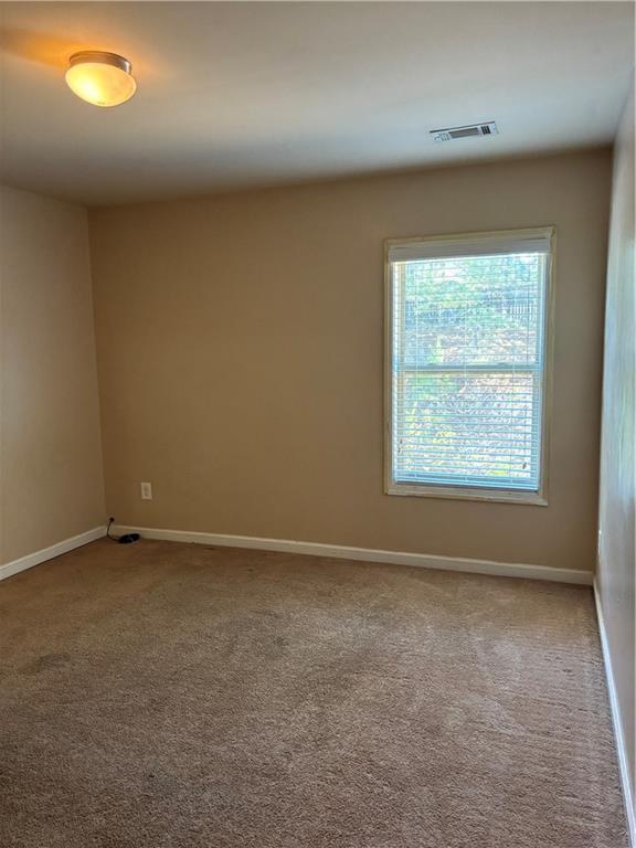 7562 Watson Circle Locust Grove, GA 30248 - Photo 36 of 66 an empty room with a window