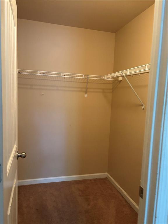 7562 Watson Circle Locust Grove, GA 30248 - Photo 37 of 66 a view of a room with racks on the wall