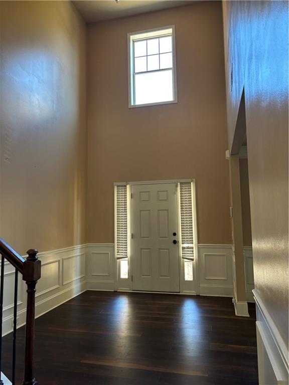 7562 Watson Circle Locust Grove, GA 30248 - Photo 5 of 66 an empty room with wooden floor and windows