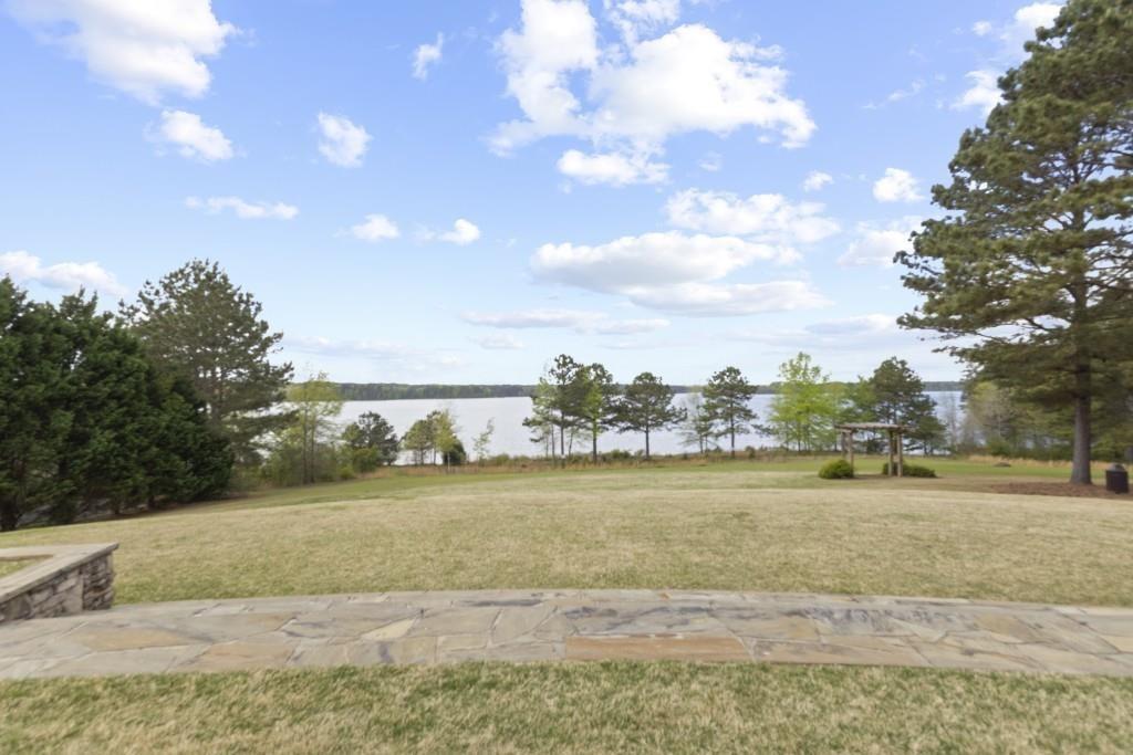 7562 Watson Circle Locust Grove, GA 30248 - Photo 57 of 66 a view of a lake with a big yard