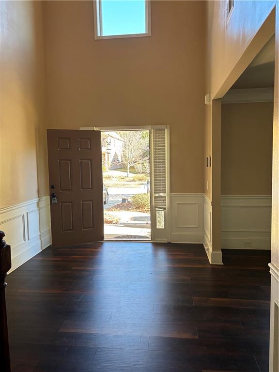7562 Watson Circle Locust Grove, GA 30248 - Photo 6 of 66 a view of an empty room with wooden floor and a window