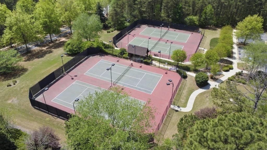 7562 Watson Circle Locust Grove, GA 30248 - Photo 61 of 66 an aerial view of a house with a yard and lake