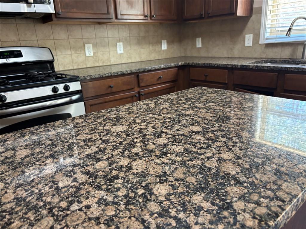 7562 Watson Circle Locust Grove, GA 30248 - Photo 8 of 66 a kitchen with a sink and cabinets