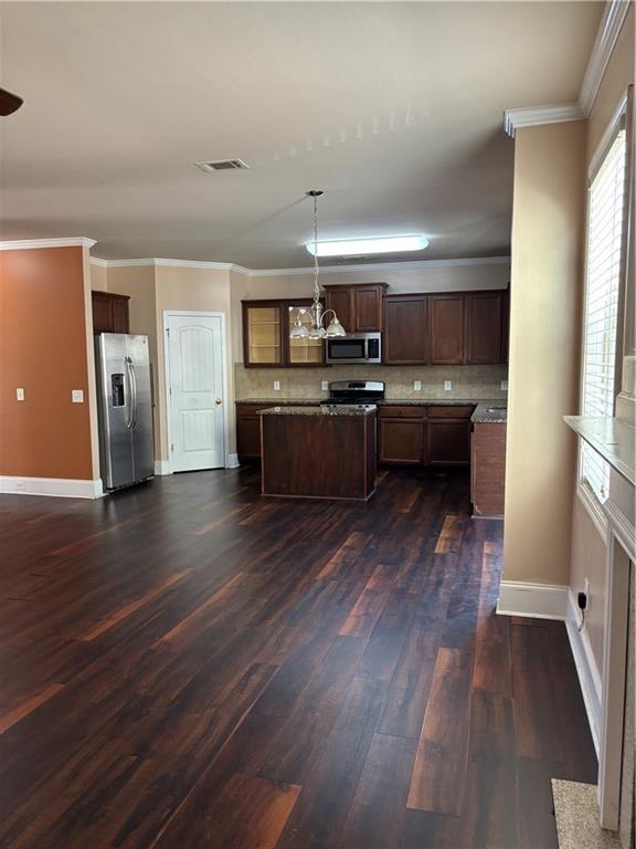 7562 Watson Circle Locust Grove, GA 30248 - Photo 10 of 66 a kitchen with a refrigerator and a stove top oven