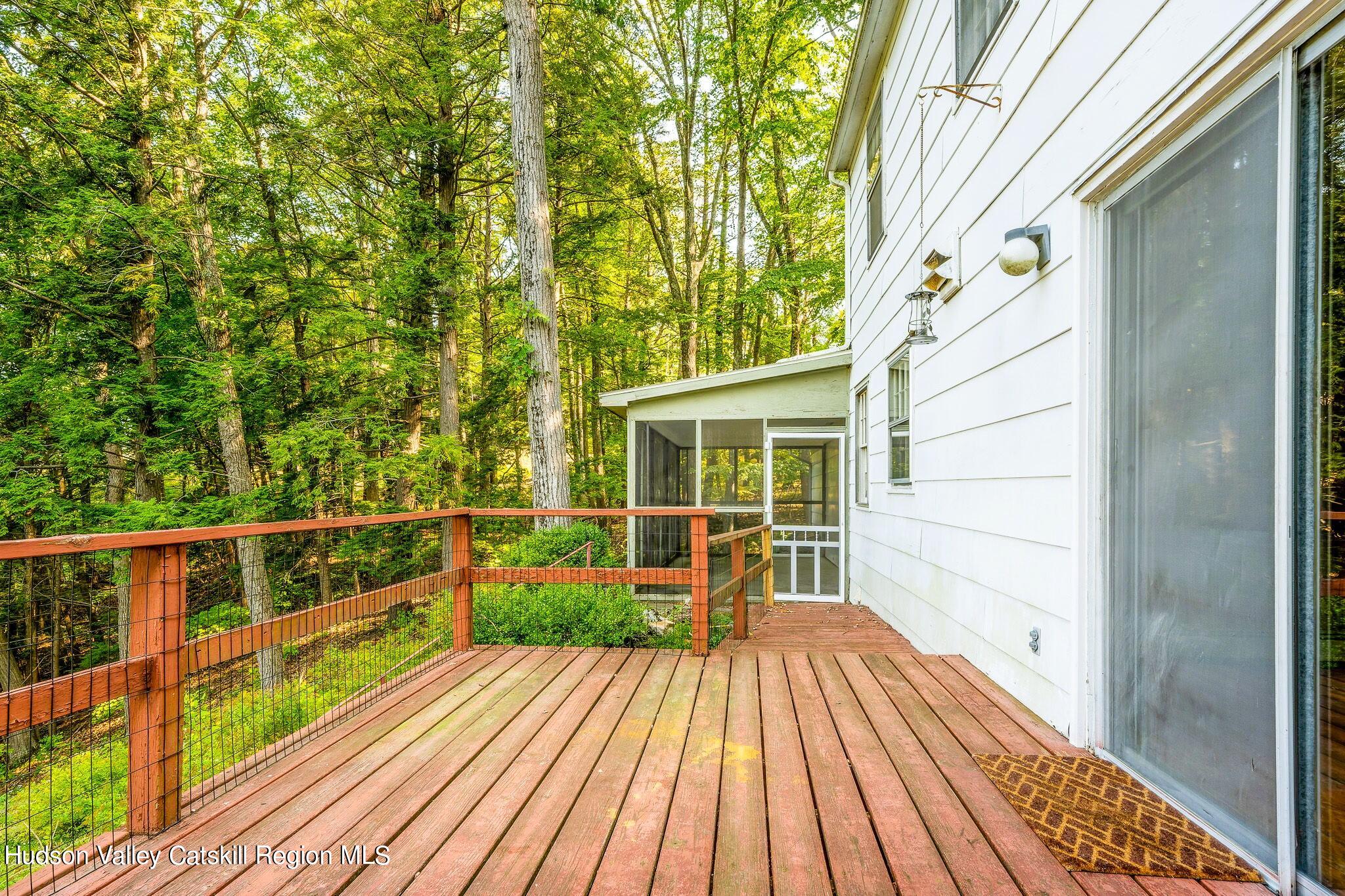 15 Dewitt Drive Saugerties, NY 12477 - Photo 2 of 5 a view of balcony with wooden floor and fence