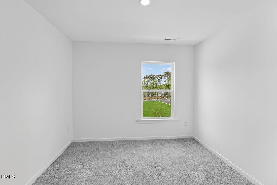 1324 West Garner Road, Unit 101 Garner, NC 27529 - Photo 26 of 29 an empty room with a window