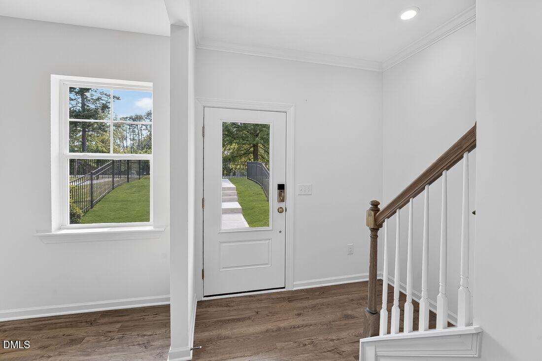 1324 West Garner Road, Unit 101 Garner, NC 27529 - Photo 6 of 29 a view of staircase with white walls and windows