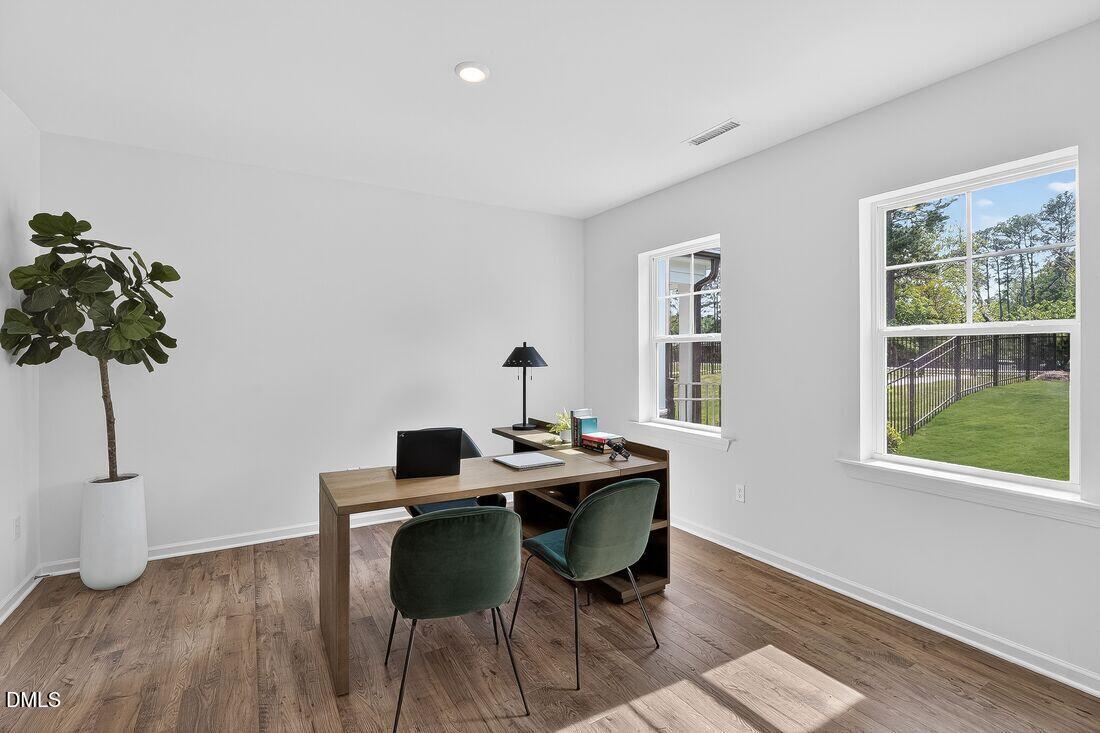 1324 West Garner Road, Unit 101 Garner, NC 27529 - Photo 7 of 29 a view of a workspace with furniture and a window