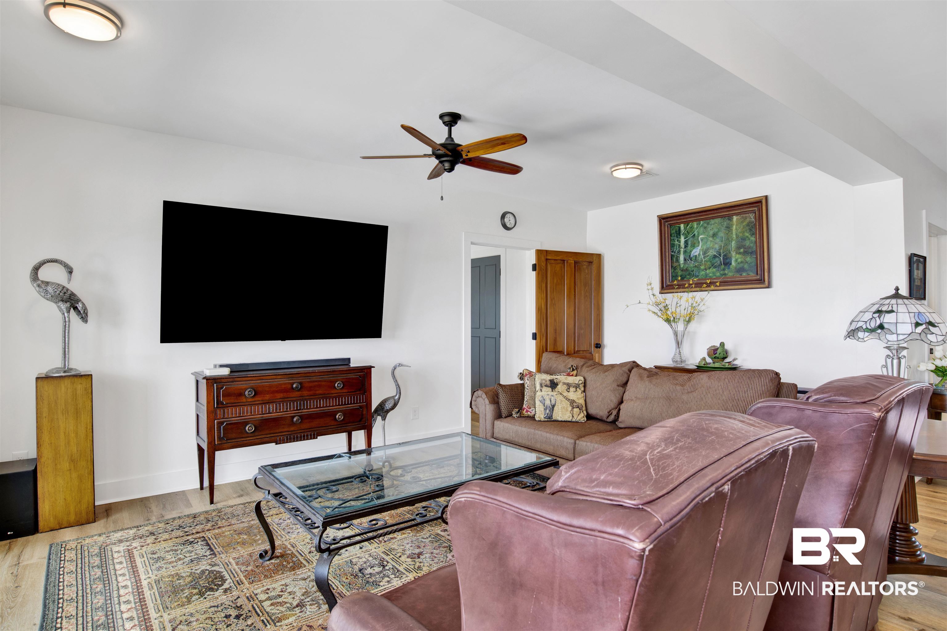 30538 River Road Orange Beach, AL 36561 - Photo 46 of 78 Living room featuring a ceiling fan and light wood-type flooring