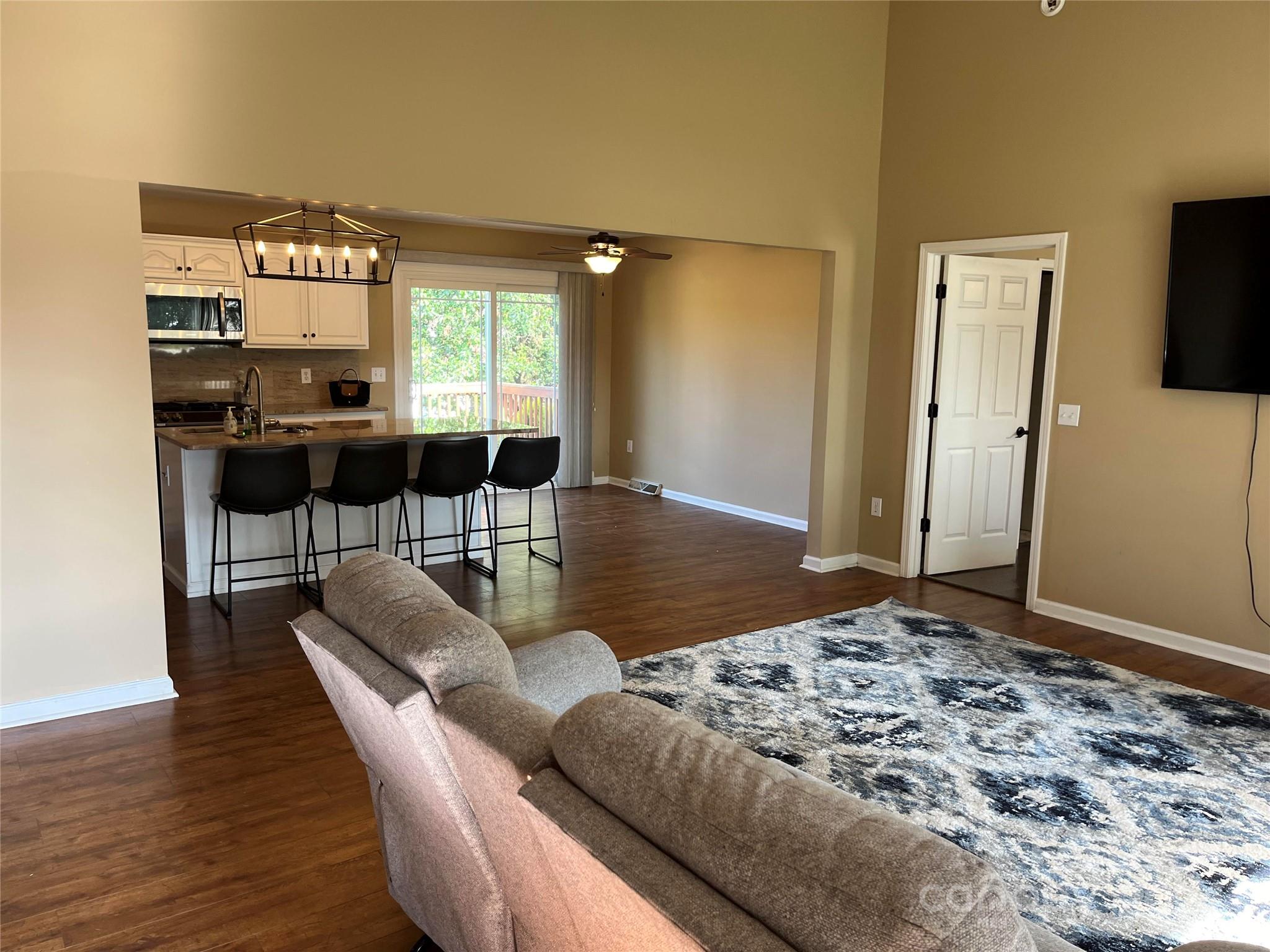 105 Doe Ridge Drive Cleveland, NC 27013 - Photo 3 of 4 a living room with furniture wooden floor and a table