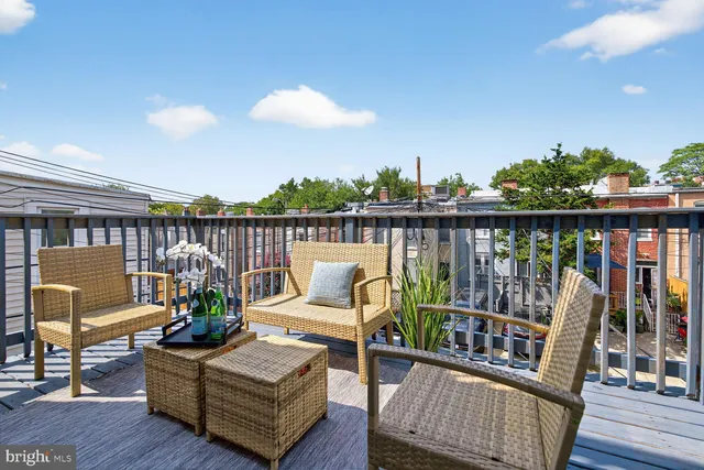 a view of a balcony with furniture