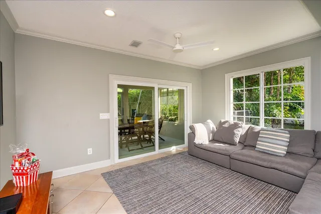 a view of a house with pool fire pit a yard and lawn chairs with plants