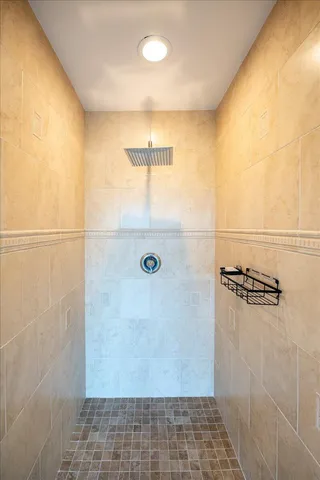 a bedroom with a large bed and a large window