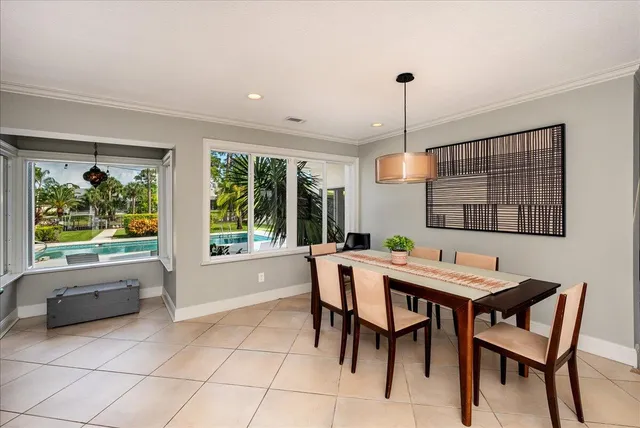 a bedroom with a bed and a lamp with window