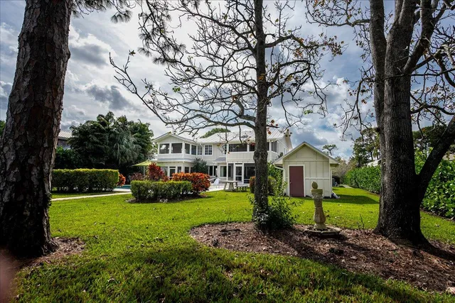 an aerial view of a house with a swimming pool