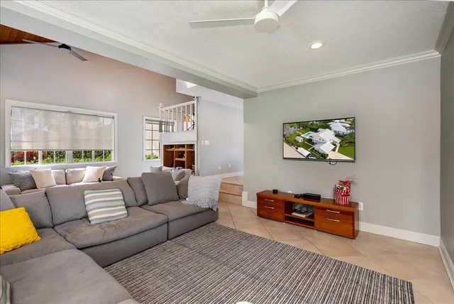 a large kitchen with kitchen island granite countertop a large counter top stainless steel appliances and cabinets