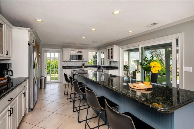 a view of a workspace with furniture and window