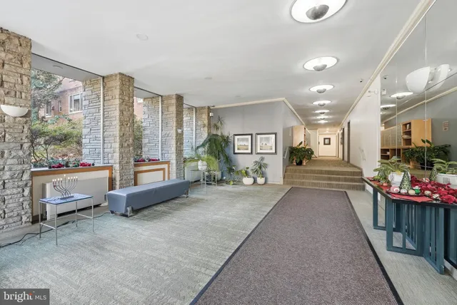 a living room filled with furniture and a table