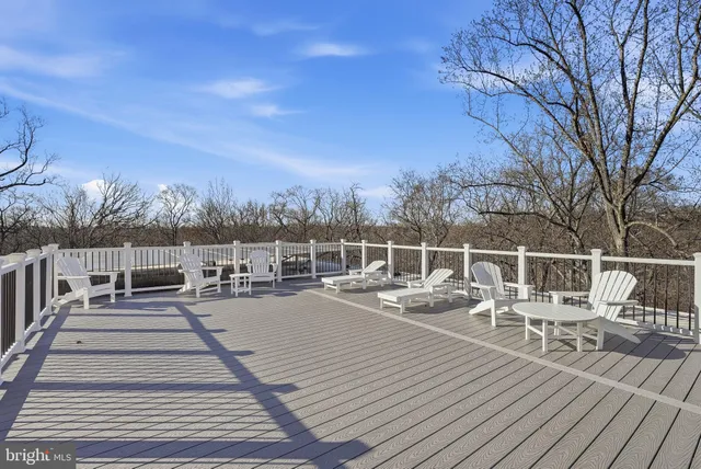 a view of a chairs on wooden deck