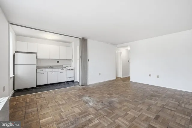a view of cabinets and refrigerator