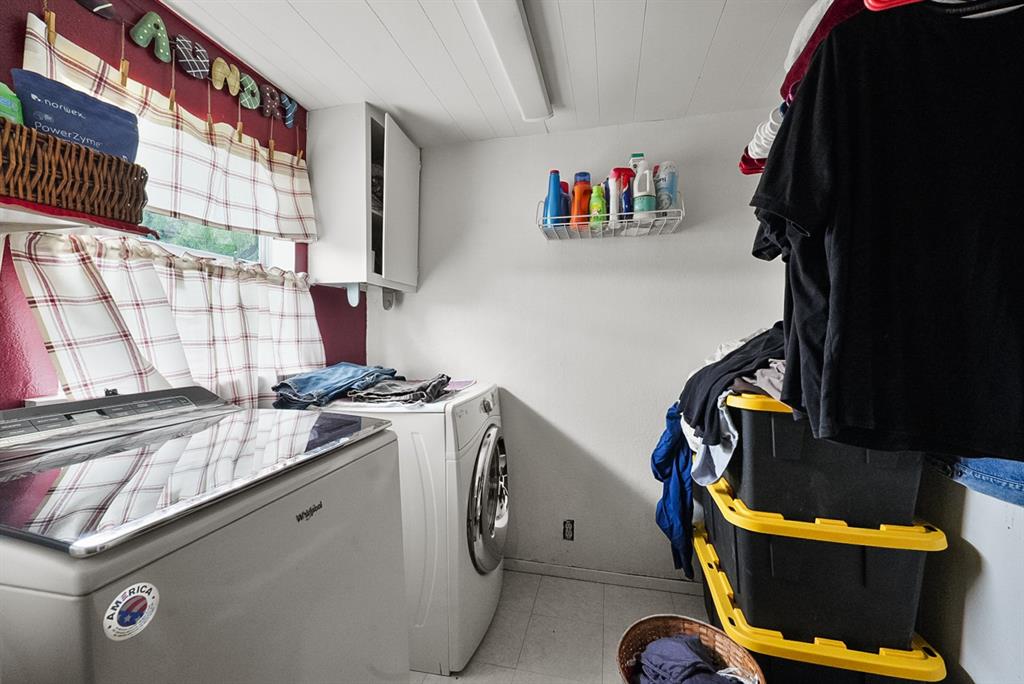 4948 Tin Top Road Weatherford, TX 76087 - Photo 12 of 24 a utility room with dryer and washer