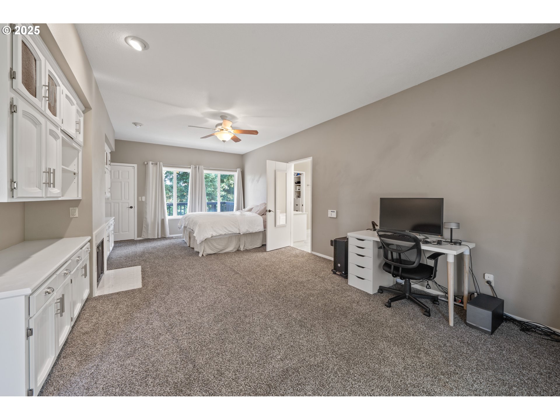 14330 Southeast Donatello Loop Happy Valley, OR 97086 - Photo 14 of 45 a living room with furniture and a flat screen tv