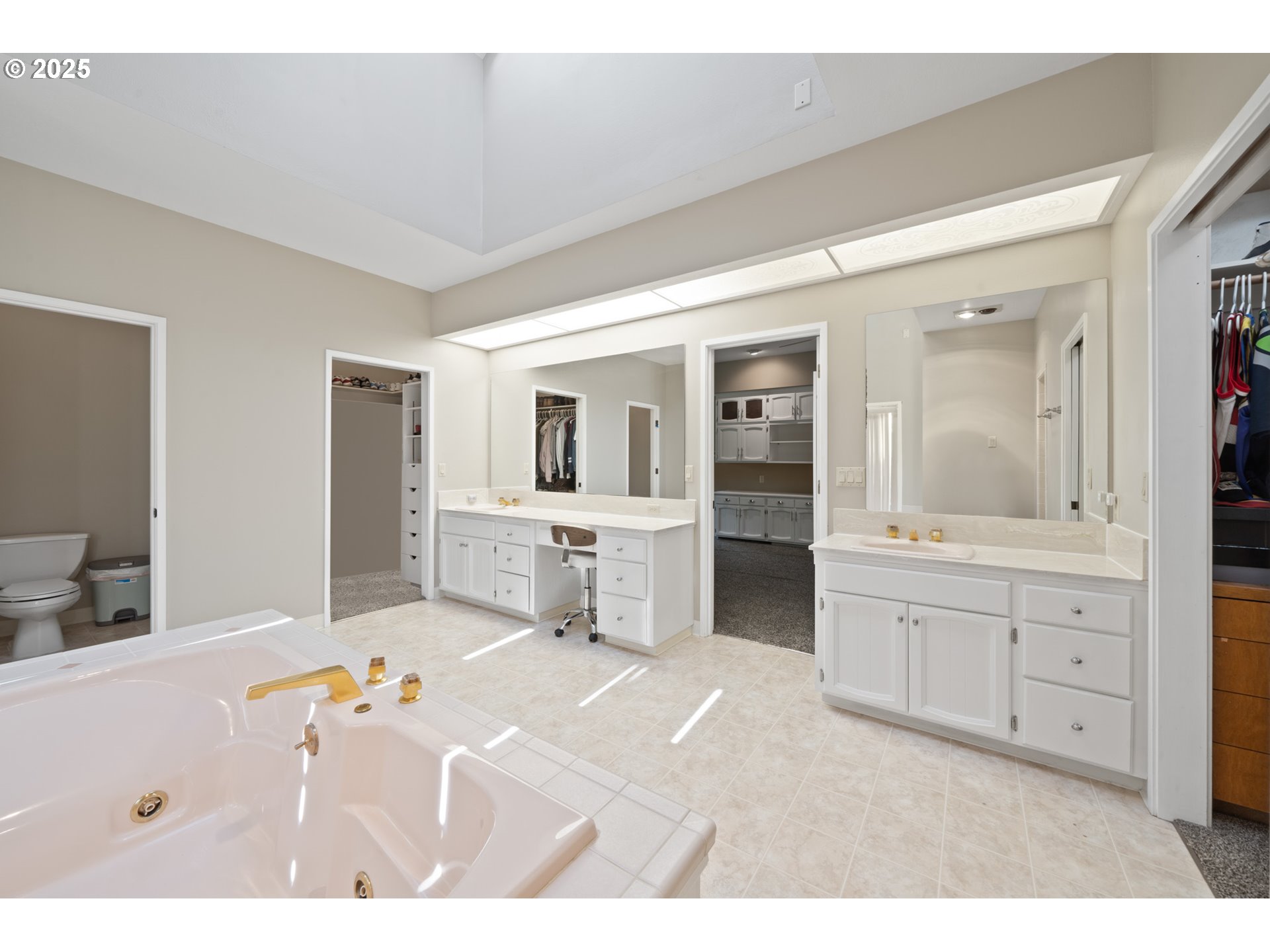 14330 Southeast Donatello Loop Happy Valley, OR 97086 - Photo 16 of 45 a bedroom with a bed and a large mirror