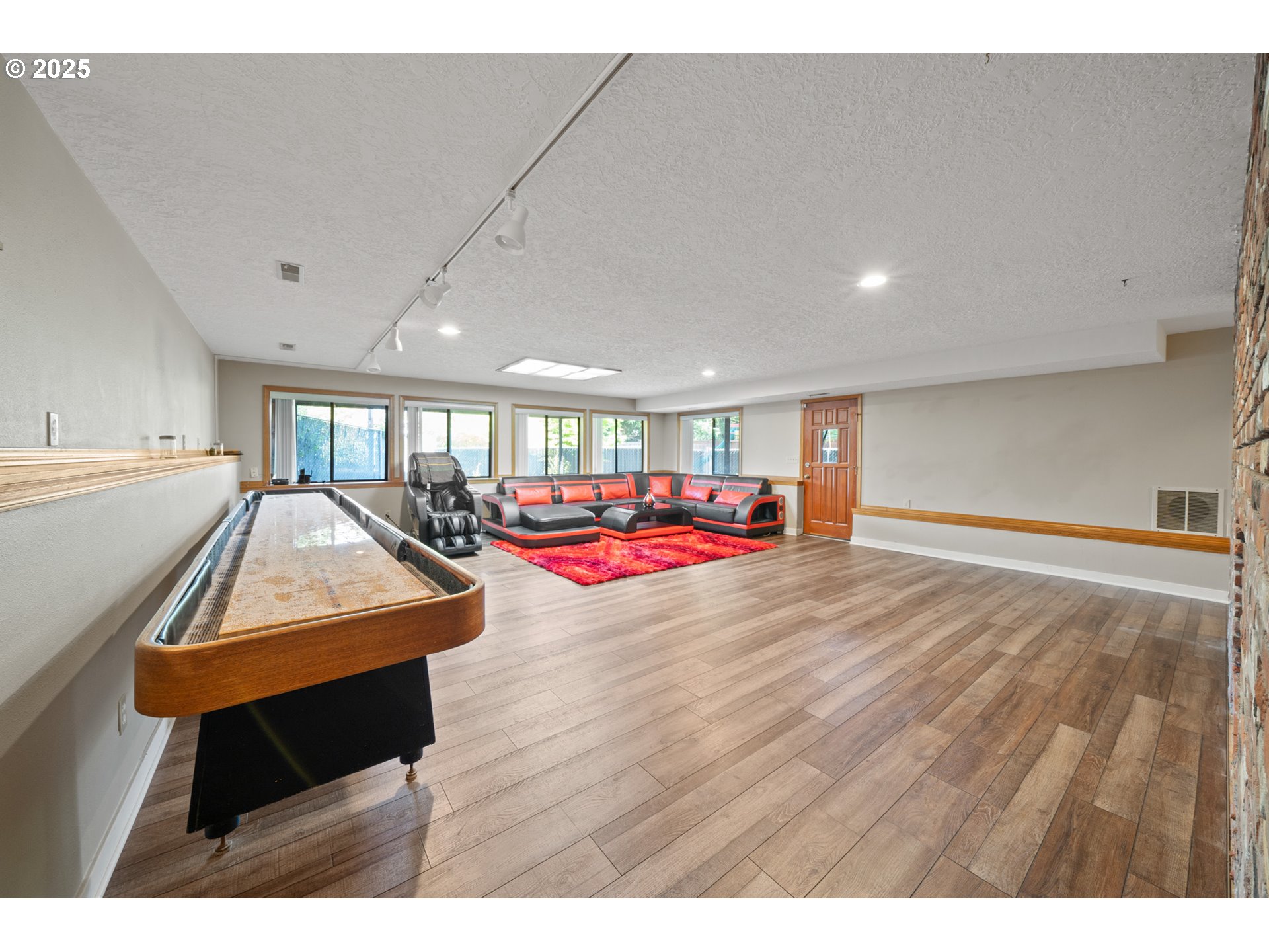 14330 Southeast Donatello Loop Happy Valley, OR 97086 - Photo 23 of 45 a living room with furniture and a wooden floor