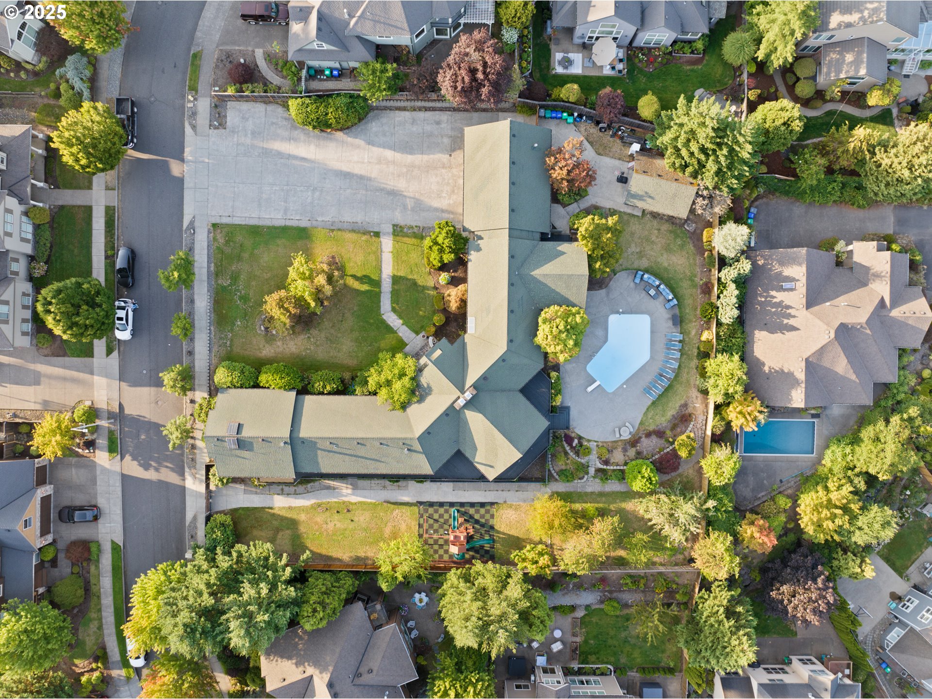 14330 Southeast Donatello Loop Happy Valley, OR 97086 - Photo 43 of 45 an aerial view of a house with a swimming pool