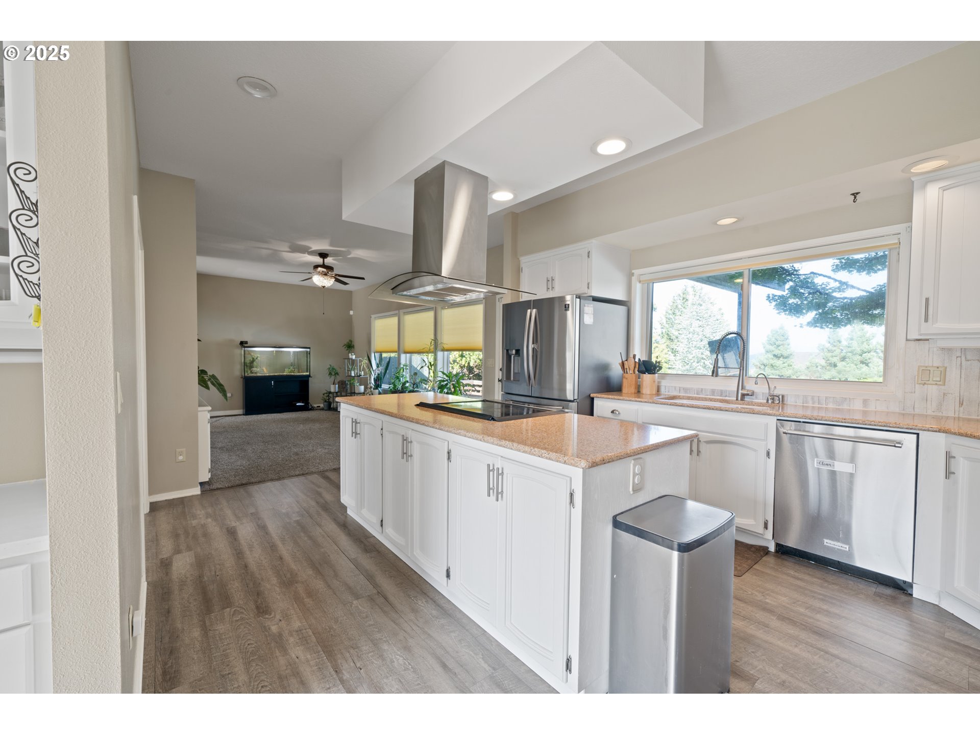 14330 Southeast Donatello Loop Happy Valley, OR 97086 - Photo 8 of 45 a large white kitchen with a large window