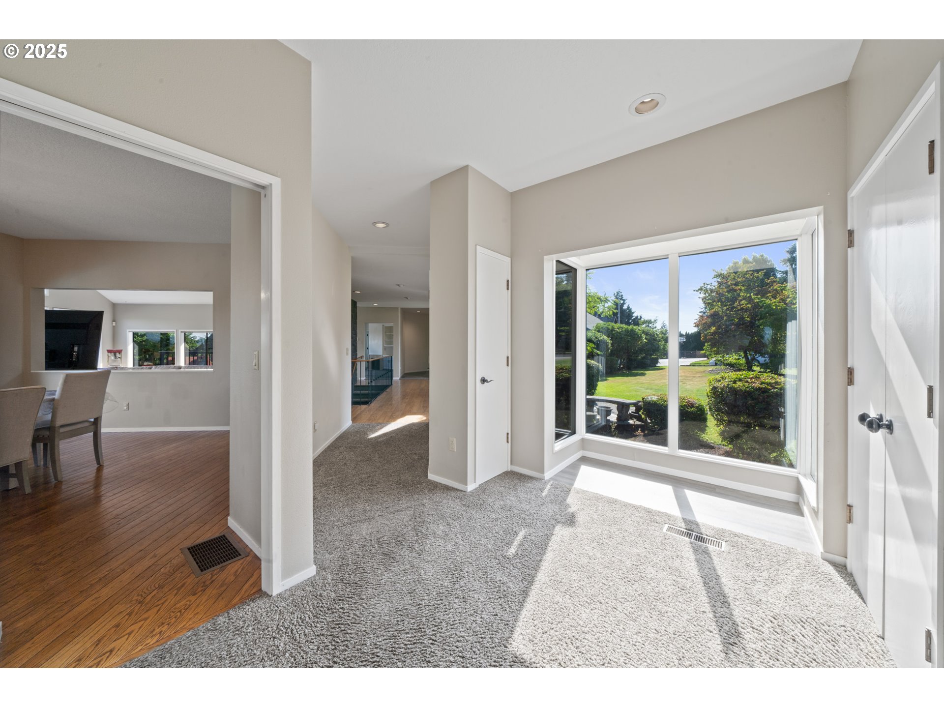 14330 Southeast Donatello Loop Happy Valley, OR 97086 - Photo 10 of 45 a living room with furniture and a floor to ceiling window