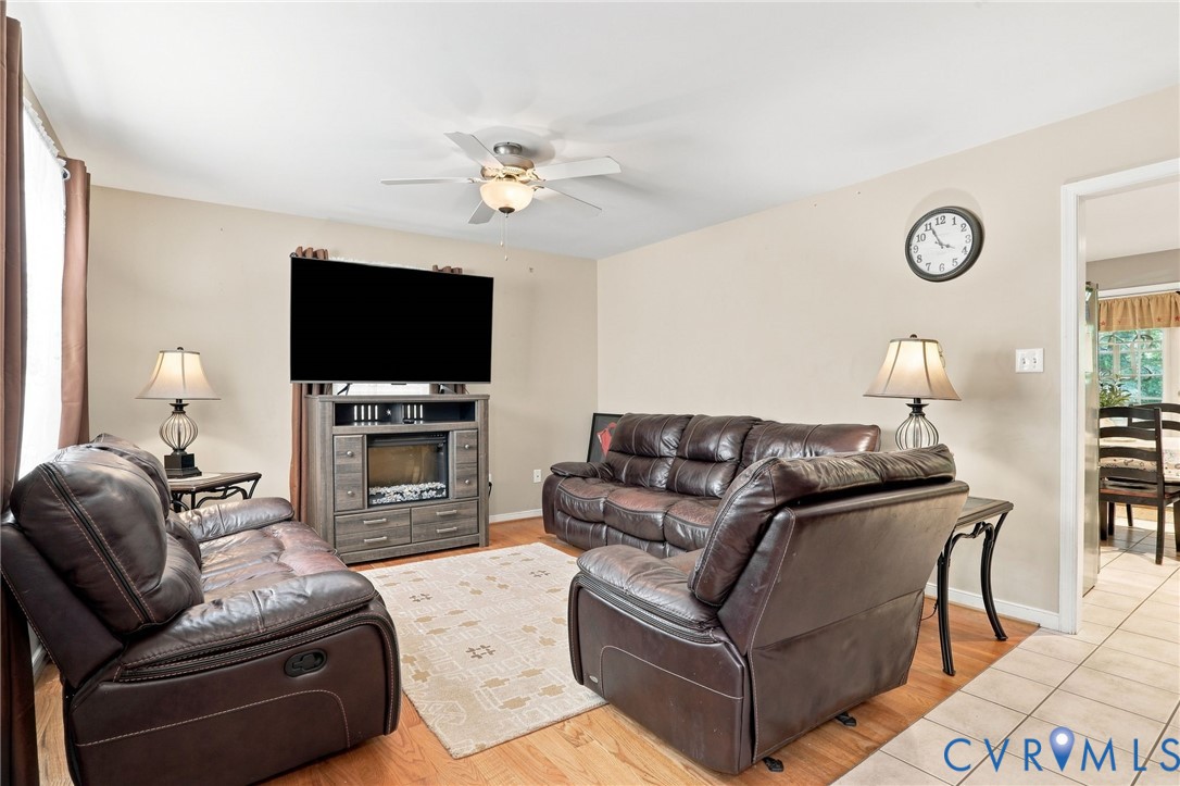 6401 Poplar Road Quinton, VA 23141 - Photo 2 of 46 Living area with wood-finish flooring, neutral wal
