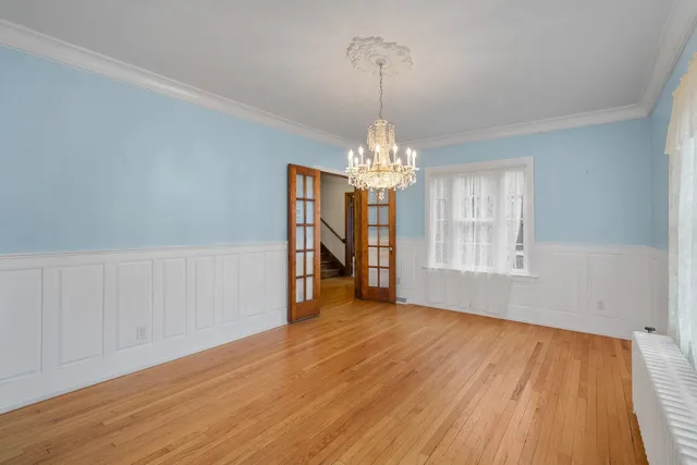 a kitchen with white cabinets stainless steel appliances and sink