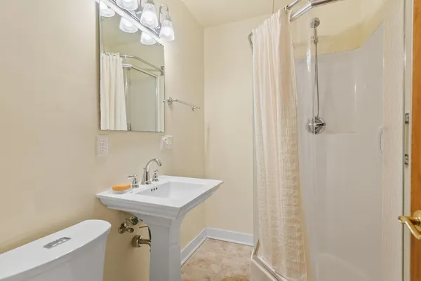 a bathroom with a double vanity sink and mirror