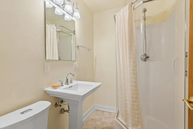 a bathroom with a double vanity sink and mirror