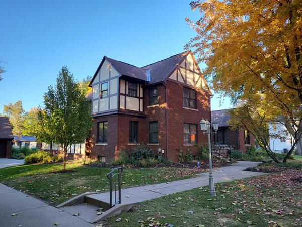 front view of a house with a yard
