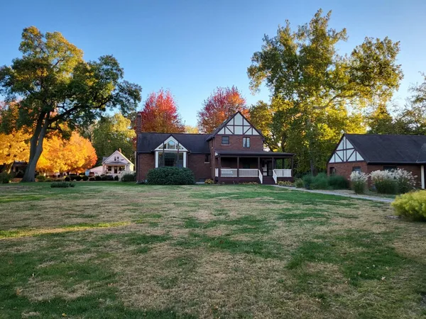a view of empty room with a fireplace and fan