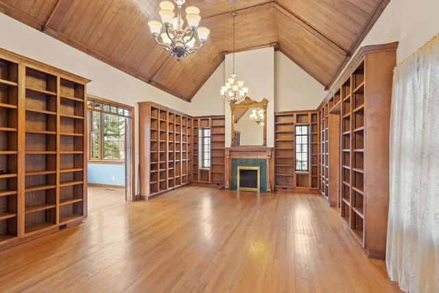 a view of a livingroom with furniture and a fireplace