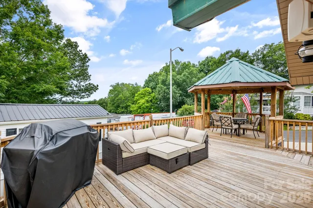 a view of a patio with couches chairs and a patio