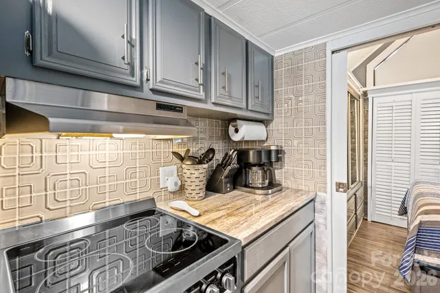 a kitchen with a stove and a microwave