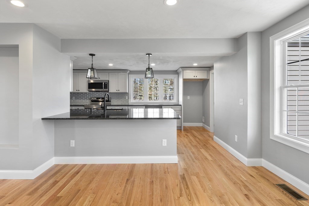 108 High Street Wareham, MA 02571 - Photo 11 of 40 a view of kitchen with sink and wooden floor