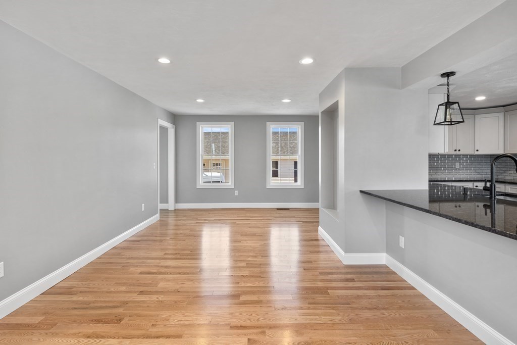 108 High Street Wareham, MA 02571 - Photo 15 of 40 a view of a kitchen with a sink and a refrigerator