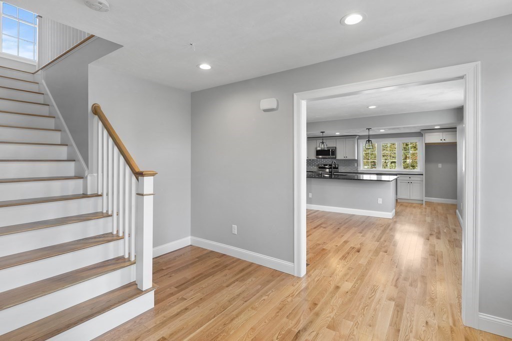 108 High Street Wareham, MA 02571 - Photo 19 of 40 a view of a living room with wooden floor and kitchen view